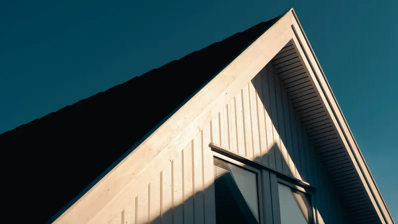A-frame home at golden hour showing a freshly installed residential roof in Utah County
