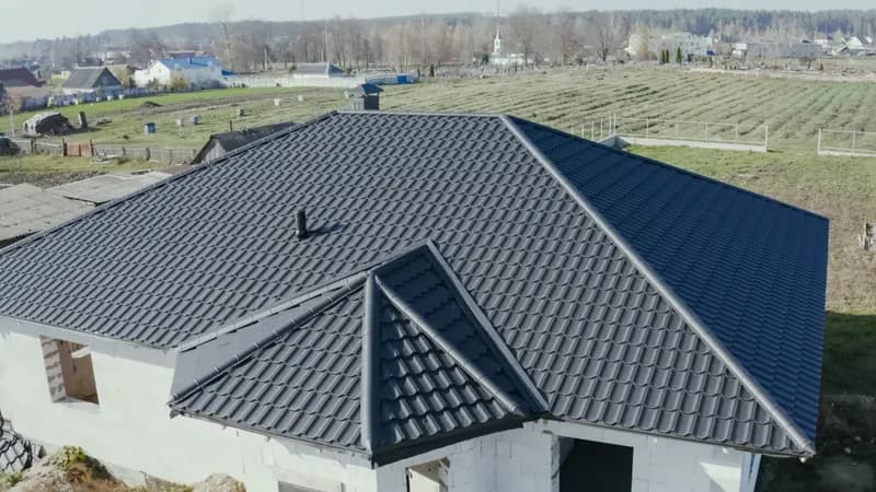 Rhino Roofing and Exteriors crew on a residential metal roof installation — Utah County